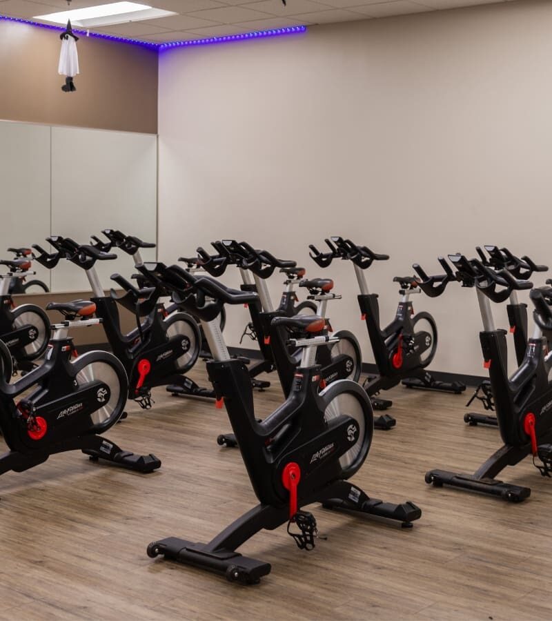 a spinning studio with cycling machines for group fitness at a york gym