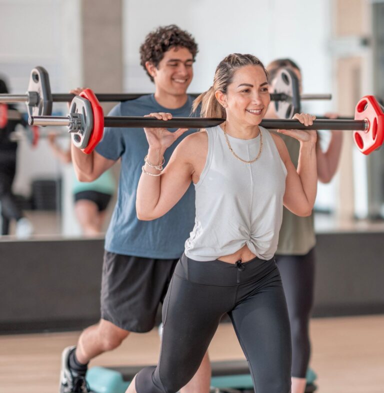 Members participating in a strength class at PA Fitness